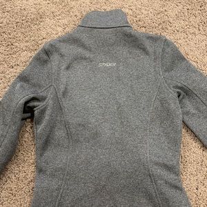 Spider core ski/snowboard sweater. Zipped pockets.